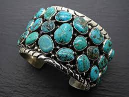 Turquoise Elegance: Exploring the Symbolism of the Silver Wrapped Arm Cuff