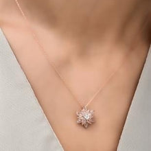 Necklace with a diamond pendant on a neutral background