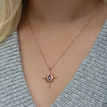 Necklace with a star-shaped pendant worn by a person