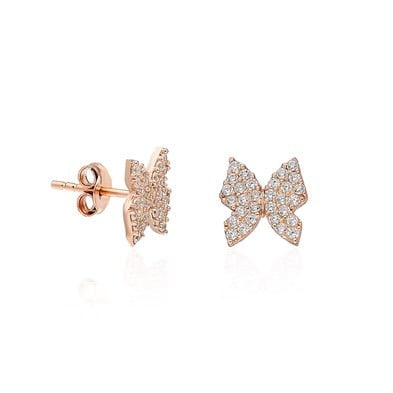 Rose gold butterfly earrings on a white background