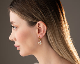 Sterling silver anchor earrings displayed on white background