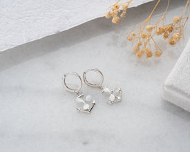 Anchor hoop earrings styled with a summer casual dress