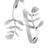 Silver leaf-shaped earrings on a white background