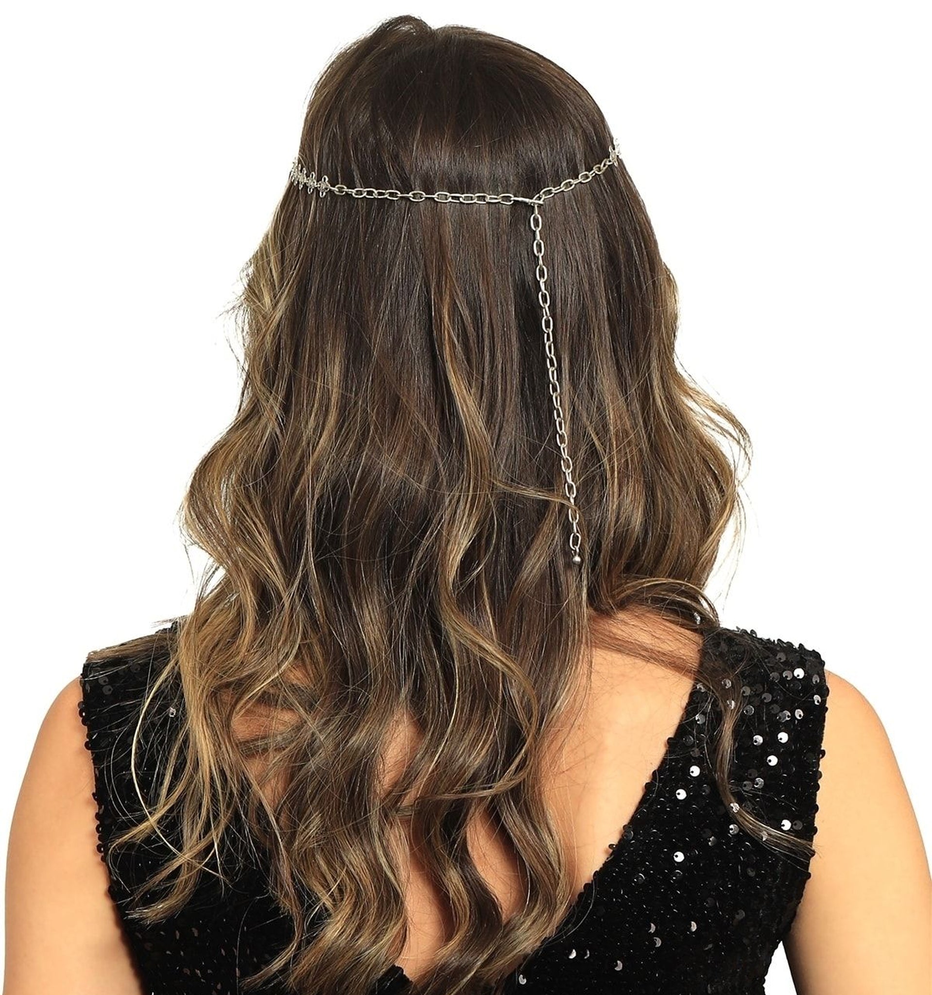 Person wearing a chain headpiece with long, wavy hair on a white background