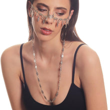 Artistic bohemian silver nose chain accessory for expressive and fashion-forward wearers.