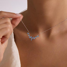 Necklace with blue stones being worn by a person