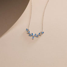Necklace with blue gemstones on a beige background
