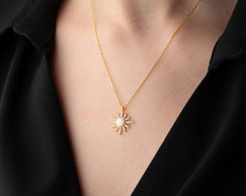 Detailed view of the handmade celestial necklace with intricate moon and star charm design.