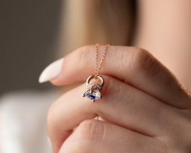 Astrology-inspired protective necklace featuring a cosmic blue gemstone encased in sterling silver.