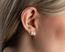 Handcrafted bird earrings in sterling silver, perfect for nature lovers and free spirits.