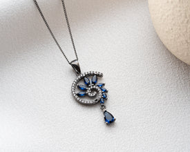 Modern Victorian mourning style with blue crystal memento