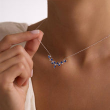 Necklace with blue stones being worn by a person