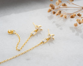 Boho bridal detail: lotus dangles peeking through lace veil