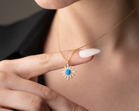 Beautifully packaged celestial jewelry gift box with an astrology-inspired silver necklace inside.