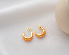 Handmade celestial sunset hoop earrings featuring vibrant galaxy hues, perfect for astrology lovers.