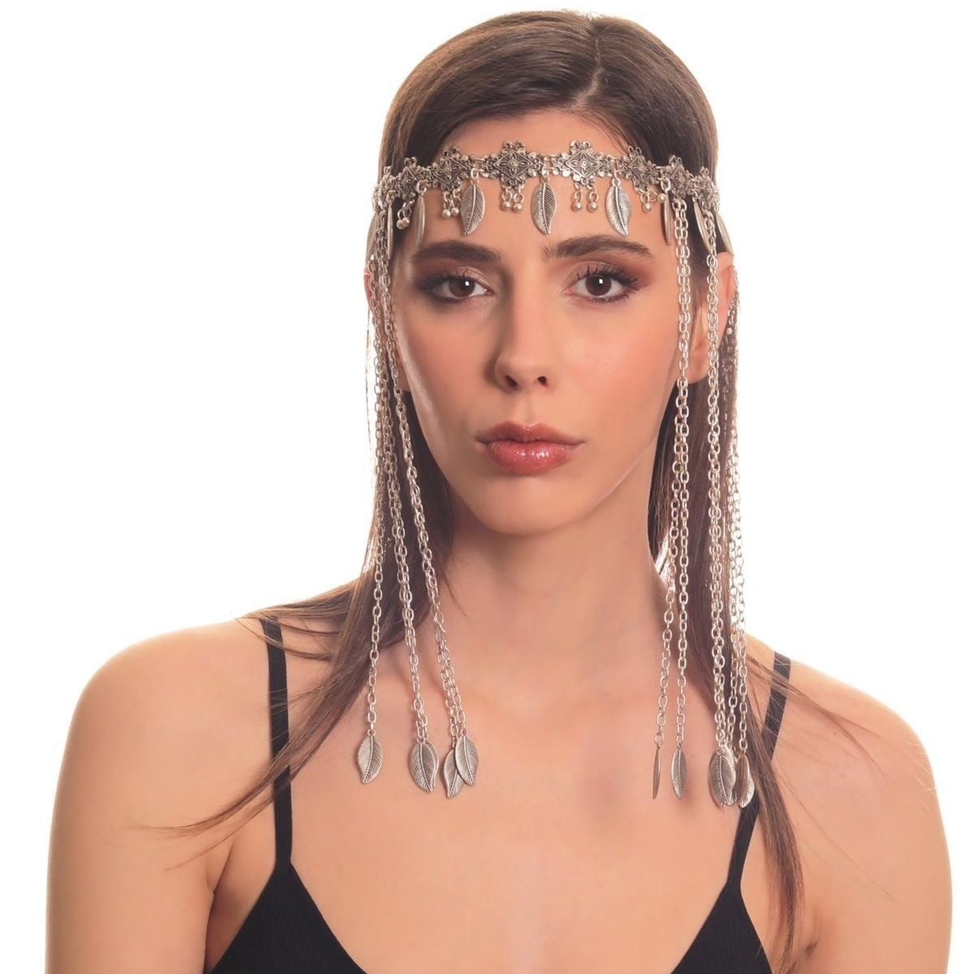 Woman wearing a decorative headpiece with chains on a white background