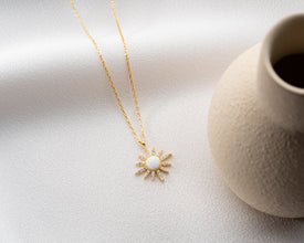 Close-up of the sterling silver moon and star charm necklace highlighting its polished finish.
