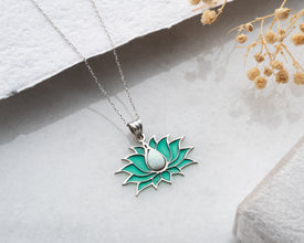 A handmade iridescent glass pendant designed for lovers of stained glass art and celestial beauty.