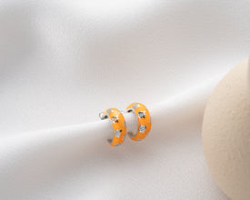 Handmade cosmic hoop earrings reflecting the night skyÕs beauty with a stunning iridescent glow.