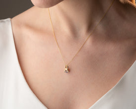 Handmade Crystal Claw Evil Eye Necklace featuring a celestial-inspired blue gemstone in a sterling silver claw setting.