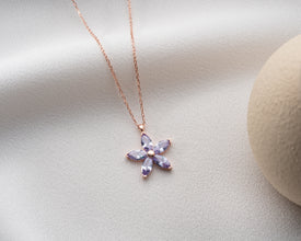 Nature-inspired silver floral charm, a botanical necklace for everyday wear.