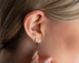 Minimalist silver bird stud earrings in 925 sterling silver, designed for everyday elegance.