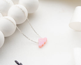 Sky-themed opal necklace symbolizing love and creativity.