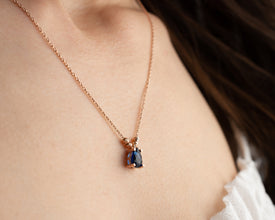 Close-up of the natural blue sapphire pendant set in sterling silver.