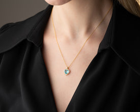 A sterling silver heart necklace with aquamarine gemstone for everyday wear.