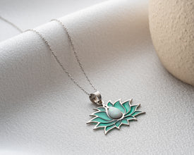  A dreamy opal pendant necklace reflecting soft pastel tones and cosmic beauty.