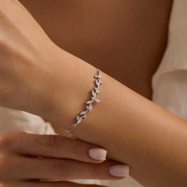 Silver bracelet on a wrist with a blurred background