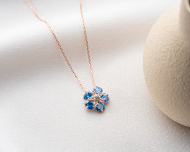 Handmade sterling silver blue topaz flower charm