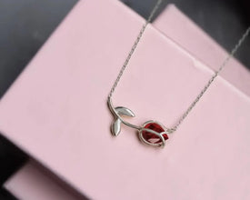 Elegant Sterling Silver Tulip Necklace featuring a deep red garnet gemstone.