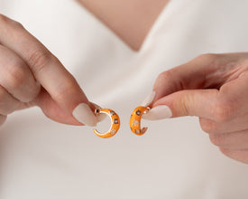Lightweight boho hoop earrings featuring a sunset-inspired celestial design.