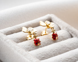 Casual daytime look with playful ladybug earrings and denim jacket