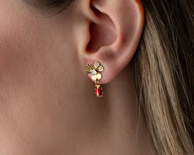 Front view of whimsical floral ladybug dangle earrings in sterling silver