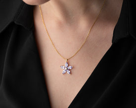 Dainty silver flower charm necklace, a perfect anniversary or birthday gift.
