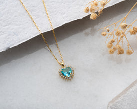 High-quality sterling silver necklace with a vibrant aquamarine heart gemstone.