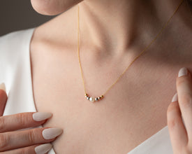 Pearl necklace displayed on white background for clarity
