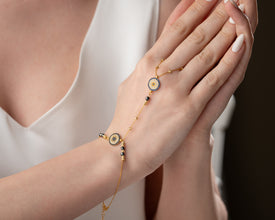 Professional styling: evil eye bracelet with blazer and watch