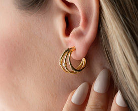 Minimalist outfit pairing: white shirt and layered hoop earrings