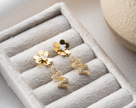 Tarot reading flatlay featuring symbolic snake earrings