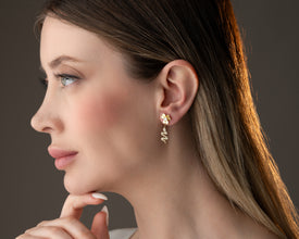 Hypoallergenic gold-tone metal for sensitive ears - close-up detail