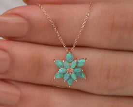 Elegant green opal birthstone necklace with spiritual significance.