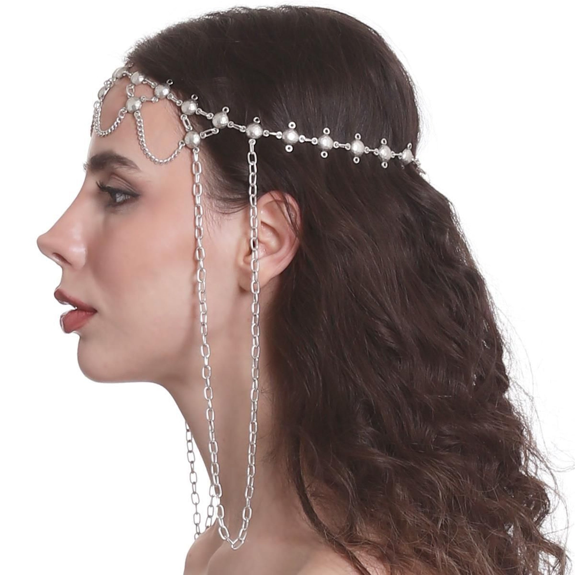 Woman wearing a decorative headpiece with chains and pearls on a white background