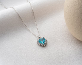 Elegant aquamarine heart pendant, ideal for romantic and anniversary gifts.