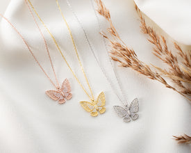 Dainty silver butterfly charm necklace, ideal for layering jewelry