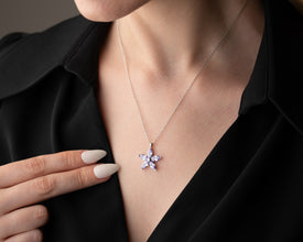 Dainty flower necklace in sterling silver, perfect for minimalist and feminine styling.