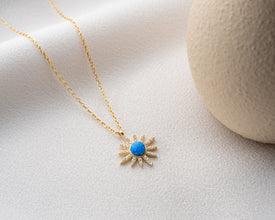 A handcrafted sterling silver celestial pendant necklace symbolizing the universe's mystery and beauty.