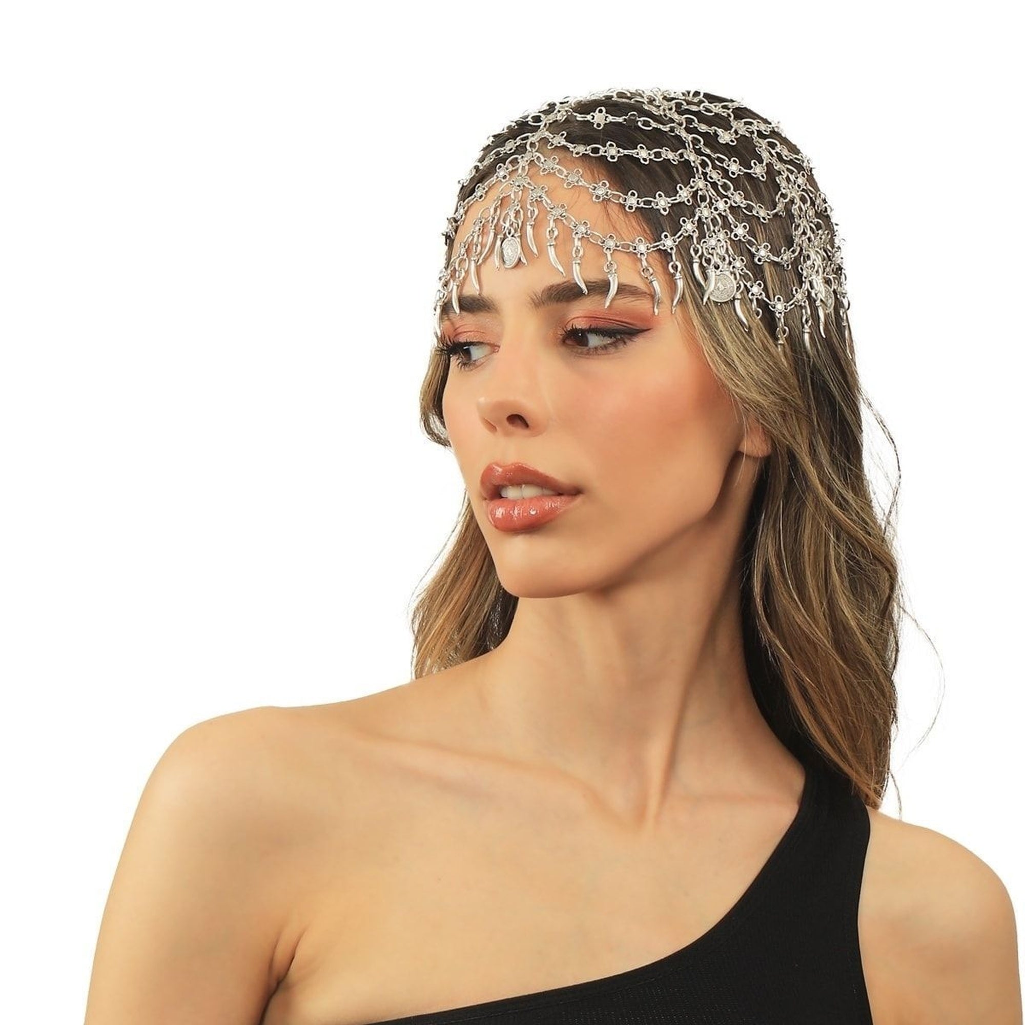 Woman wearing a decorative headband with chains on a white background